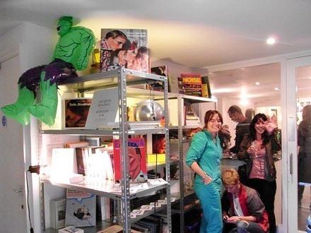 The opening night of CT Pocket bookshop inside BEARSPACE gallery: shelves crammed with art books, inflatable green Hulk figures suspended from above, visitors pressed together in the narrow space